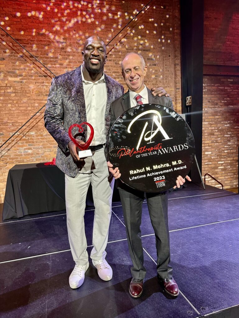 Rahul Mehra and Titus O'Neil winning the Philanthropic Lifetime Achievement Award from Tampa Bay Business and Wealth Magazine